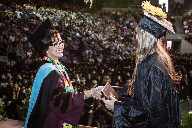 Then GCC President Dr. Leyba-Ruiz Congradulating Student at Commencement Ceremony